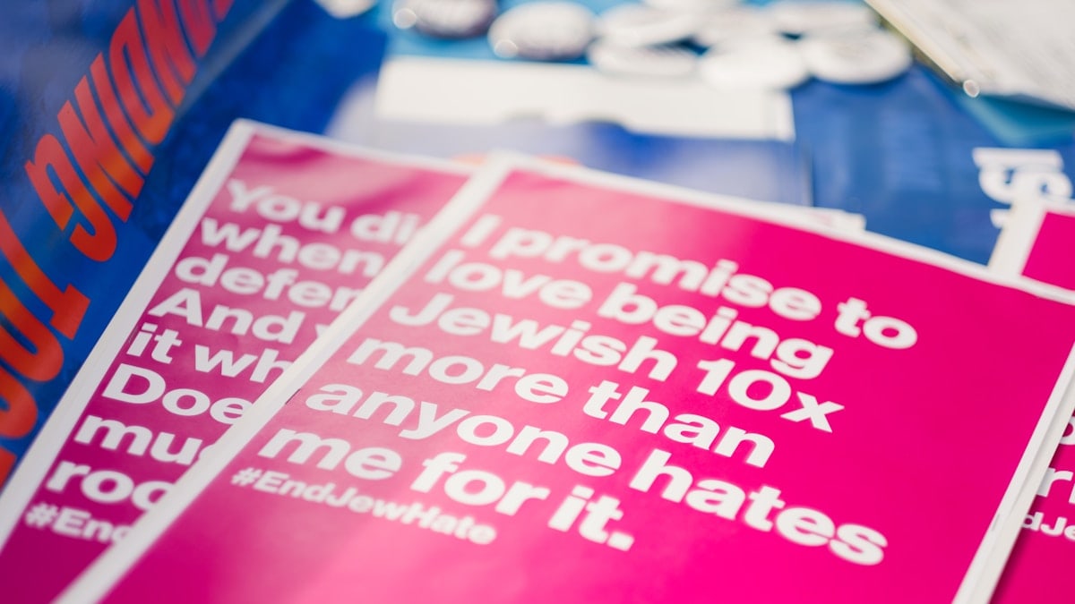 JewBelong posters at a march against antisemitism.